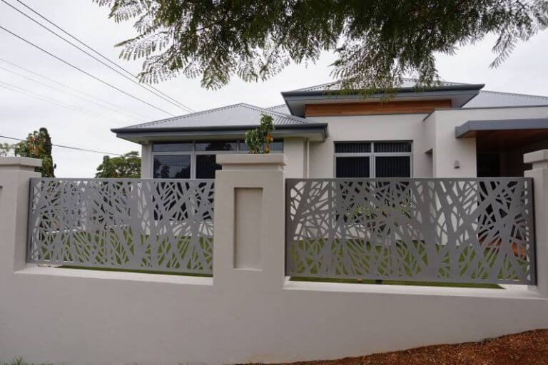 Decorative steel fence panels around a home