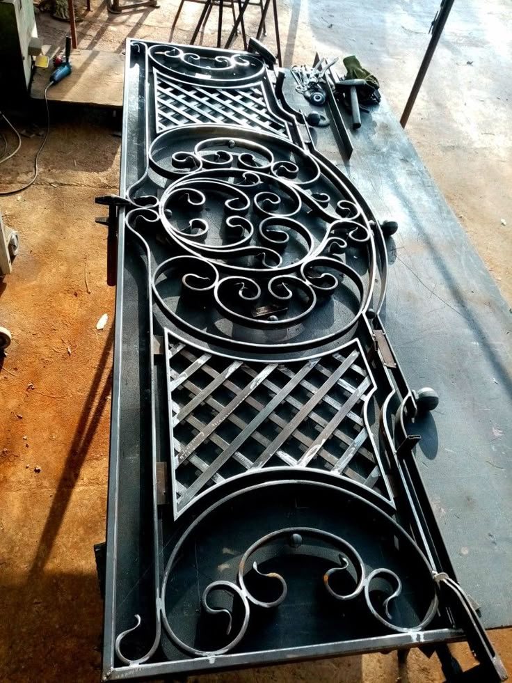 Wrought iron gate panel on the workbench mid-build