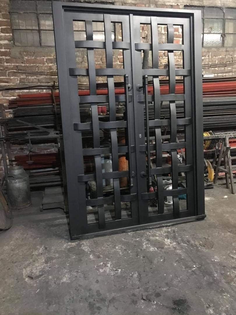 Finished steel gate standing in the shop before delivery